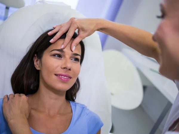 Dermatologist discussing cosmetic treatment options with a patient