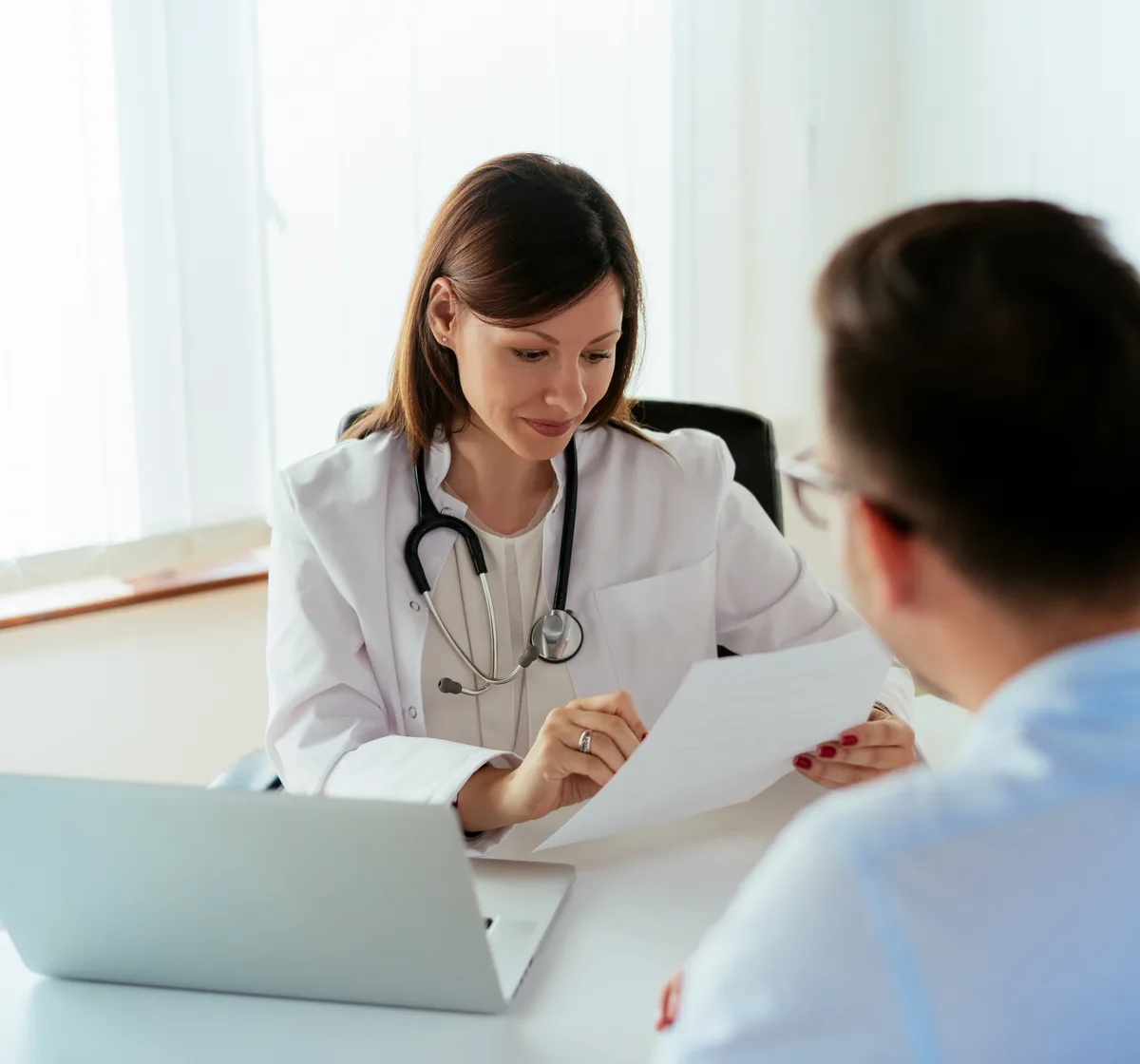 Patient discussing eczema symptoms and triggers with a dermatologist