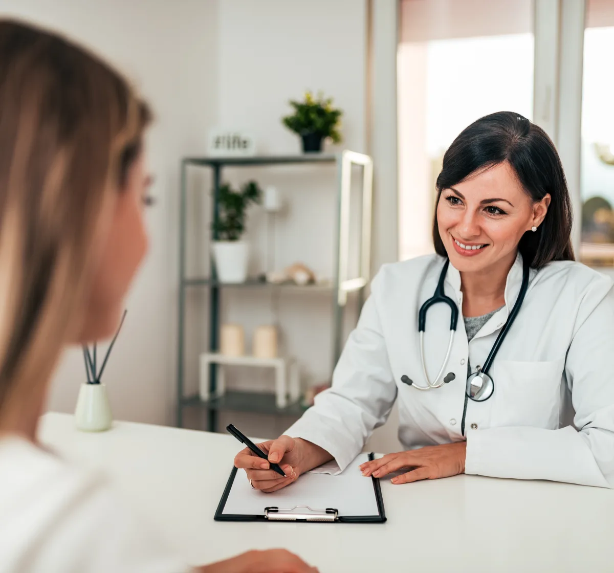 Patient discussing rosacea flare-ups and triggers with a dermatologist