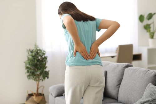 Constipation related lower back pain illustration