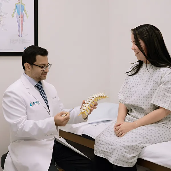 Dr, Khan explaining his patient about the root causes of the disease