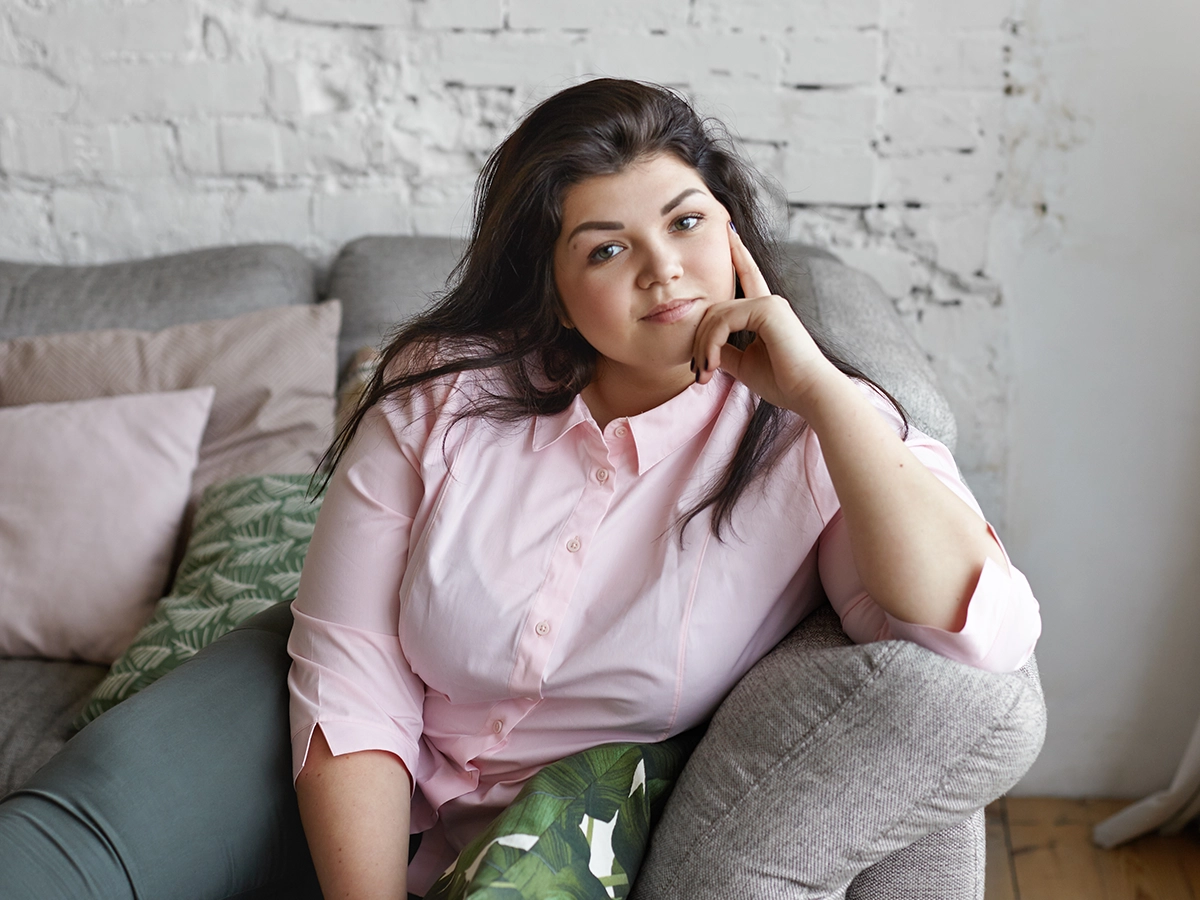 Woman on a relaxed secure video appointment from a quiet room at home