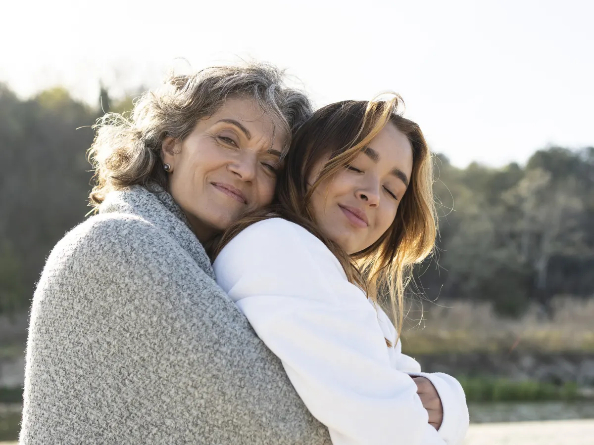Woman smiling confidently in a bright room, settled into consistent psychiatric care