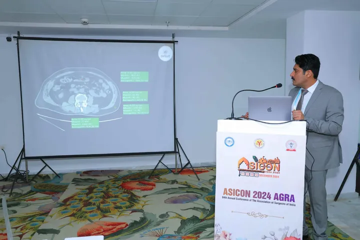 Dr. Abhimanyu Kapoor presenting a CT-scan lecture from the podium at ASICON 2024, Agra