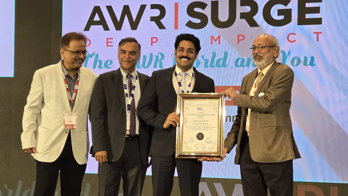 Dr. Abhimanyu Kapoor receiving a recognition award