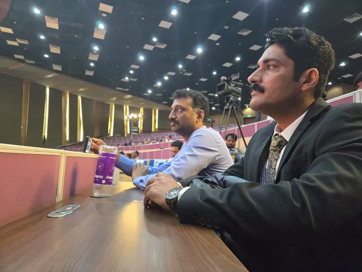 Dr. Kapoor seated on the panel at a surgical conference