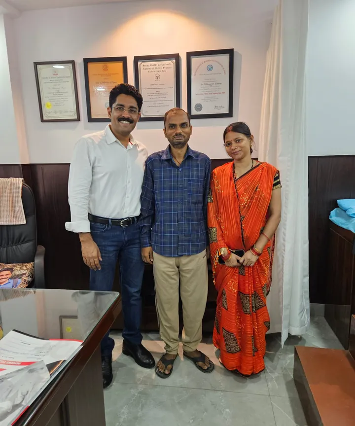 Dr. Kapoor with a patient and family in the consulting room