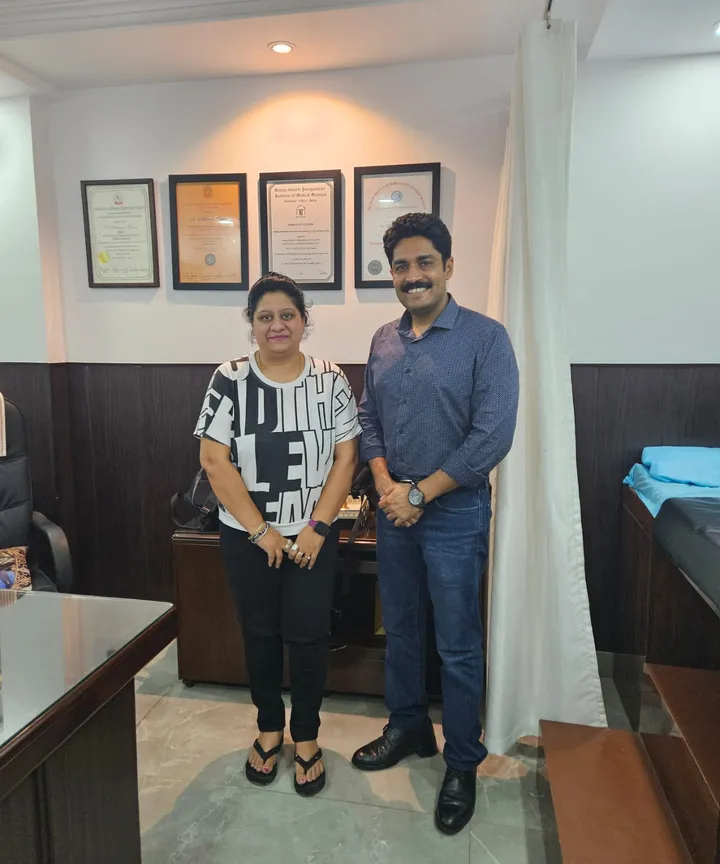 Dr. Kapoor with a patient in his consulting room