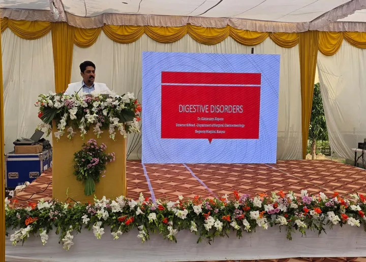 Dr. Kapoor presenting a public talk on digestive disorders