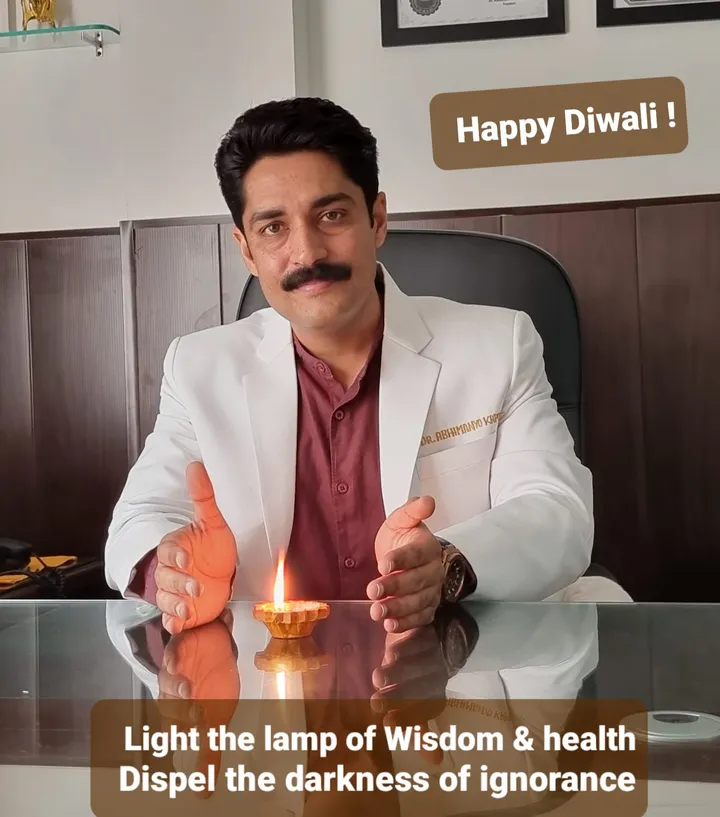 Dr. Kapoor lighting a lamp for a Diwali greeting