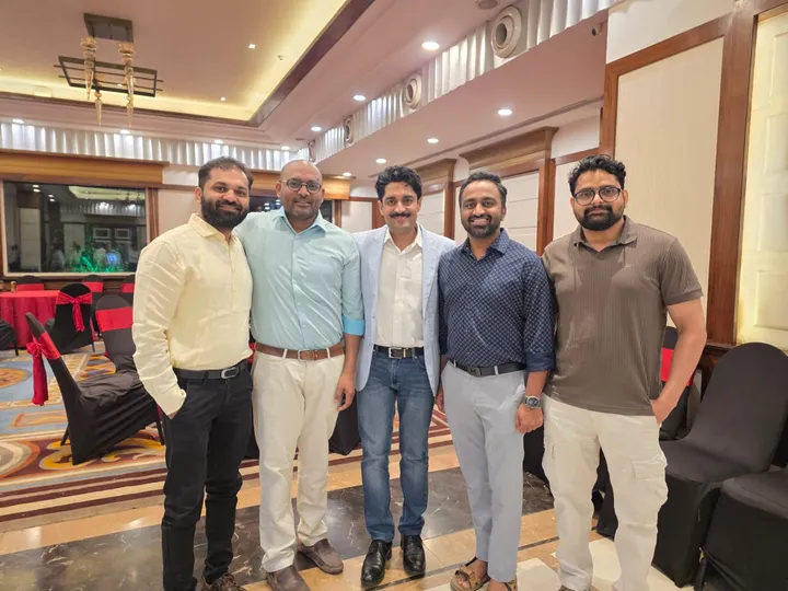 Dr. Kapoor with fellow surgeons at a conference gathering