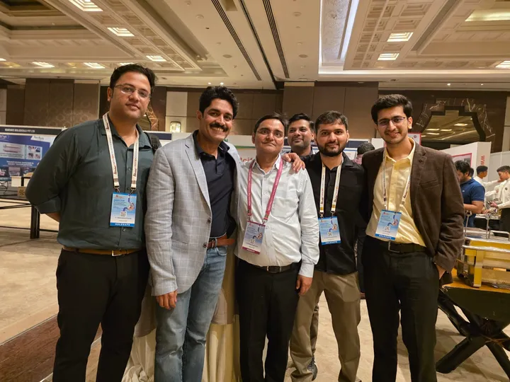 Dr. Kapoor with fellow surgeons at a conference