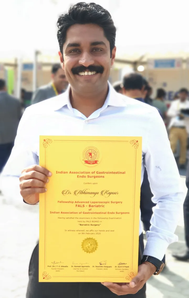 Dr. Kapoor holding his IAGES Fellowship in Advanced Laparoscopic Surgery (Bariatric) certificate