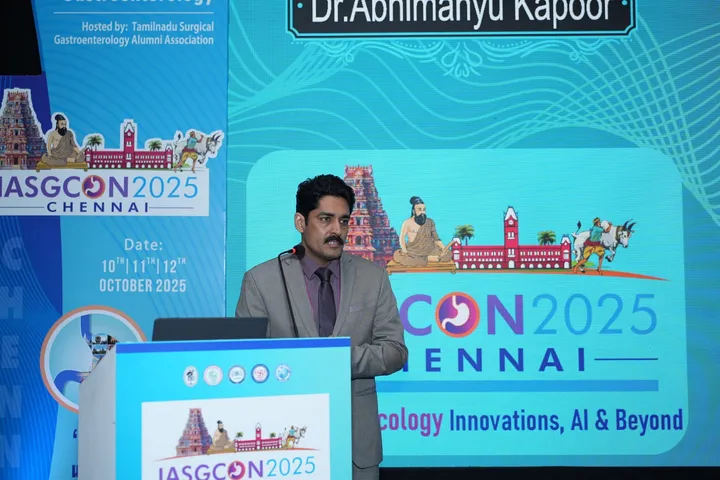 Dr. Kapoor speaking from the podium at IASGCON 2025, Chennai