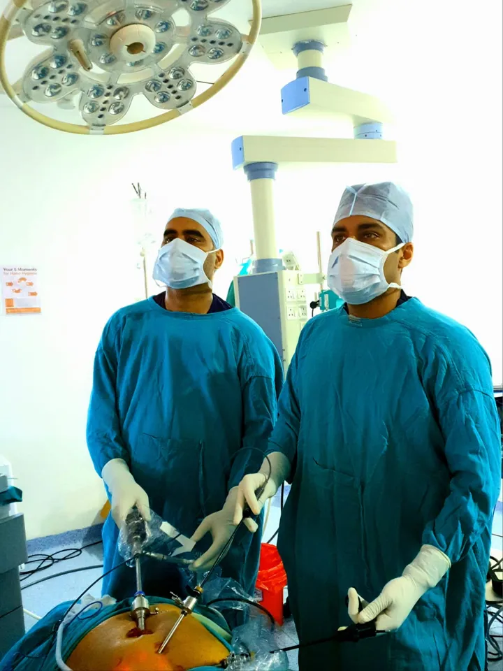 Dr. Kapoor and a colleague performing laparoscopic surgery