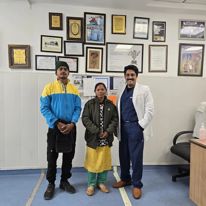 Dr. Kapoor with a patient and family in his consulting room