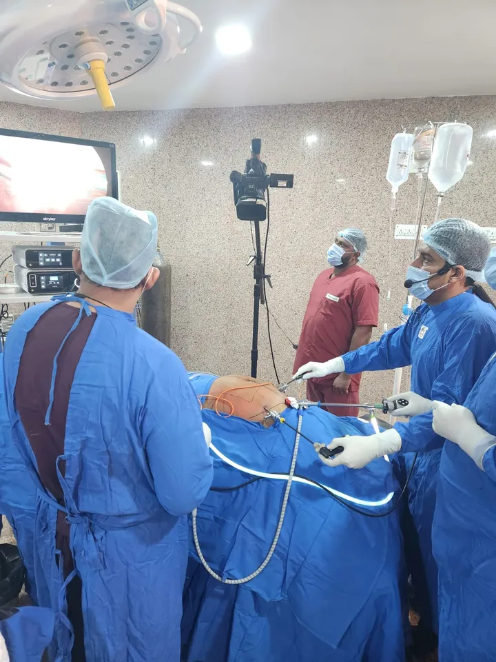 Surgical team at work under the theatre lights during a laparoscopic procedure