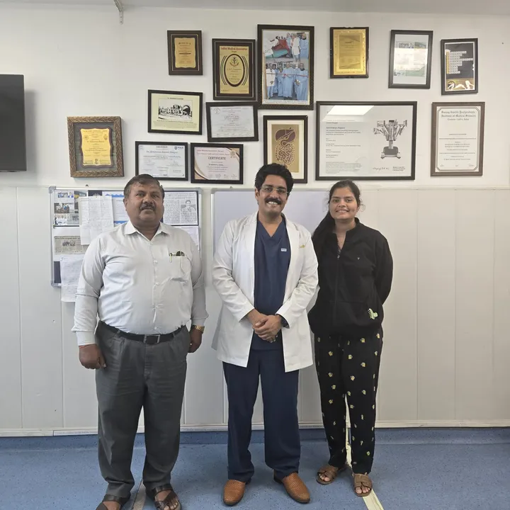 Dr. Kapoor with a patient couple at the clinic