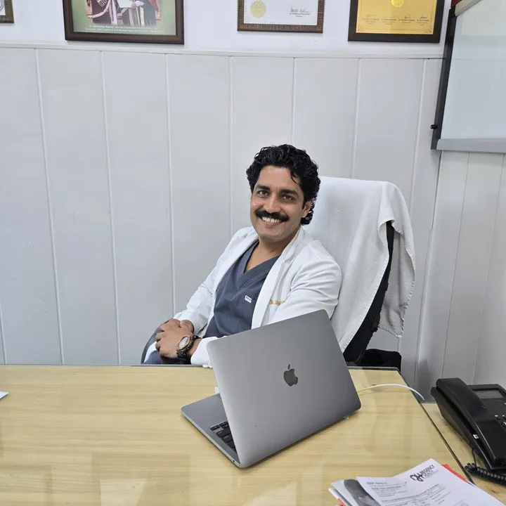 Dr. Kapoor at his consulting desk