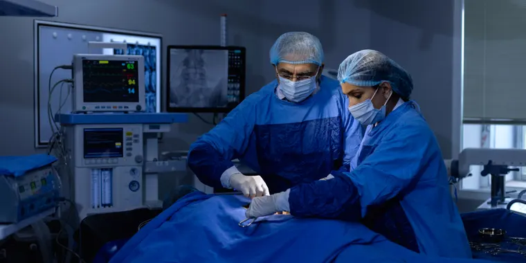 Surgical team performing a gastrointestinal cancer operation