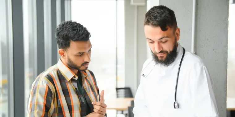 Man consulting a doctor in a clinic