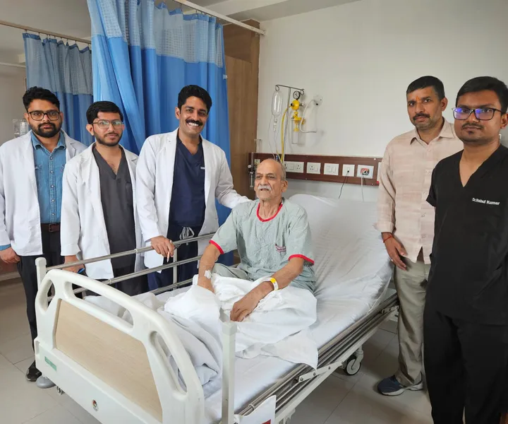 Dr. Kapoor and the surgical team with a patient before discharge