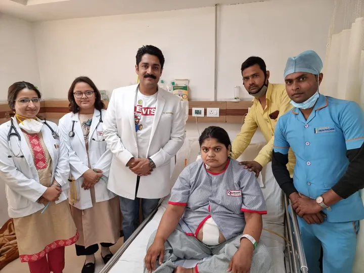 Dr. Kapoor and the ward team with a patient before discharge