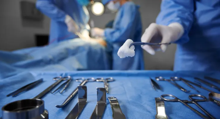Surgical team performing reconstructive cancer surgery