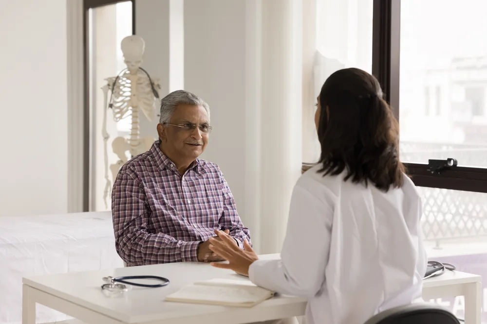 Patient discussing his diagnosis with a specialist while considering a second opinion