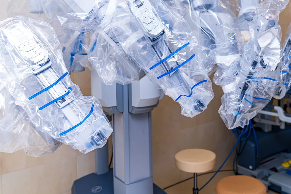Surgical team viewing a high-definition monitor during robotic surgery