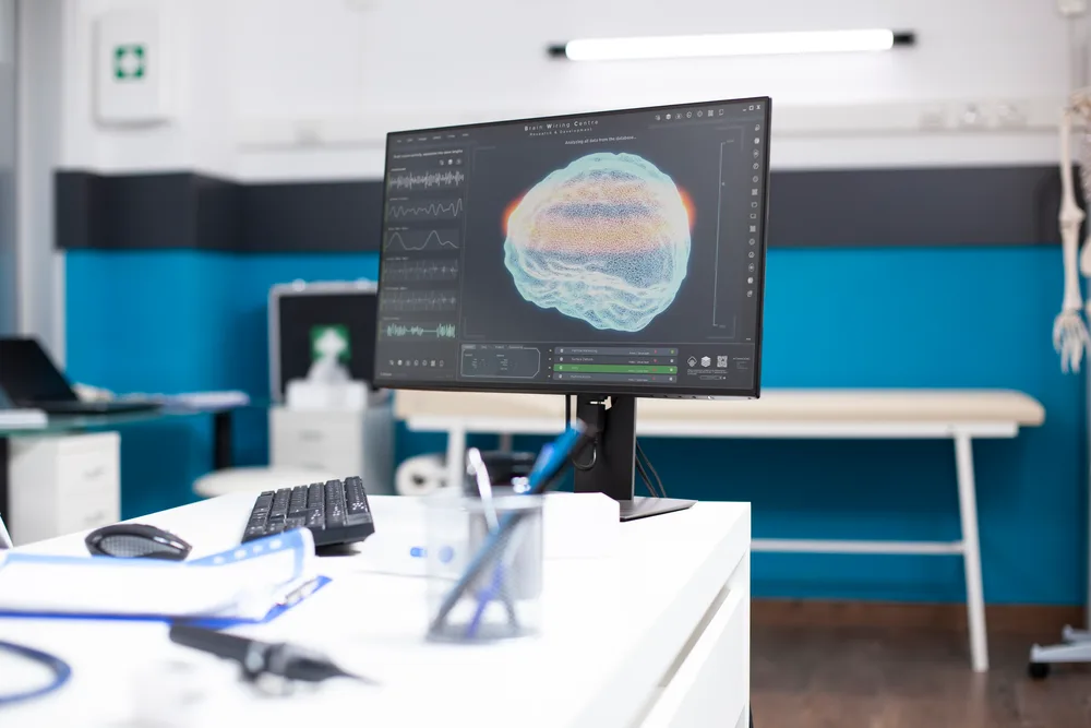 Specialist reviewing a patient’s existing skull base imaging
