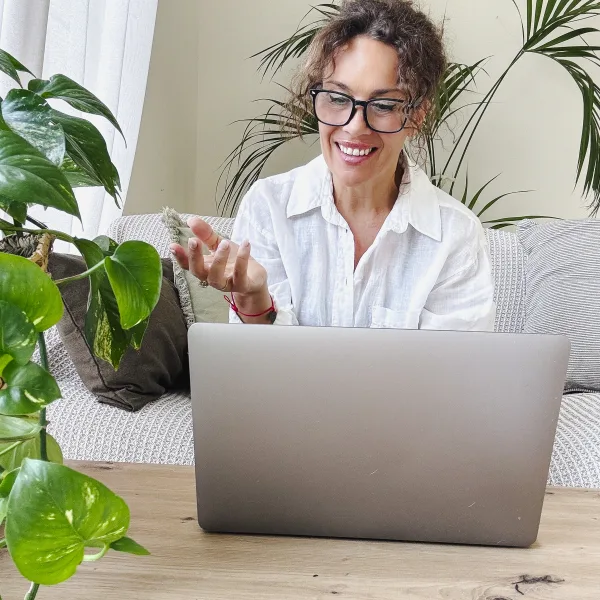 Montana woman reading through Wild Women Medicine patient resources on her laptop at home